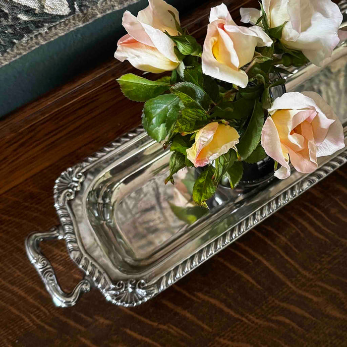 Angled three-quarter view of vintage silverplate rectangular serving tray