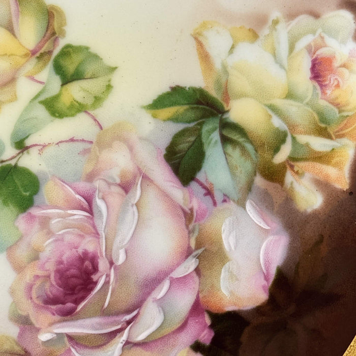 Side view of the violet flower on the Maruhon majolica vase