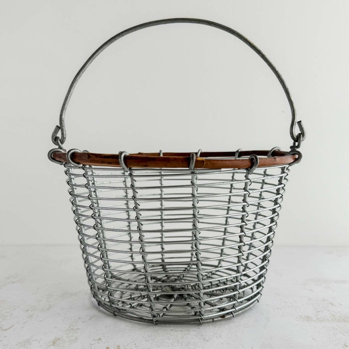 Front view of vintage rustic hand decorated copper vessel