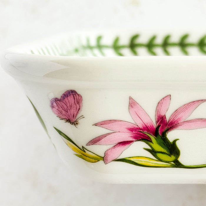 Left side profile of baking dish with floral and butterfly design