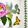 Close-up of right side of baking dish showing vine border and yellow butterfly