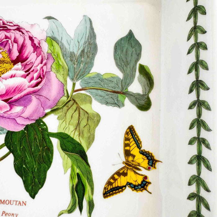 Close-up of right side of baking dish showing vine border and yellow butterfly