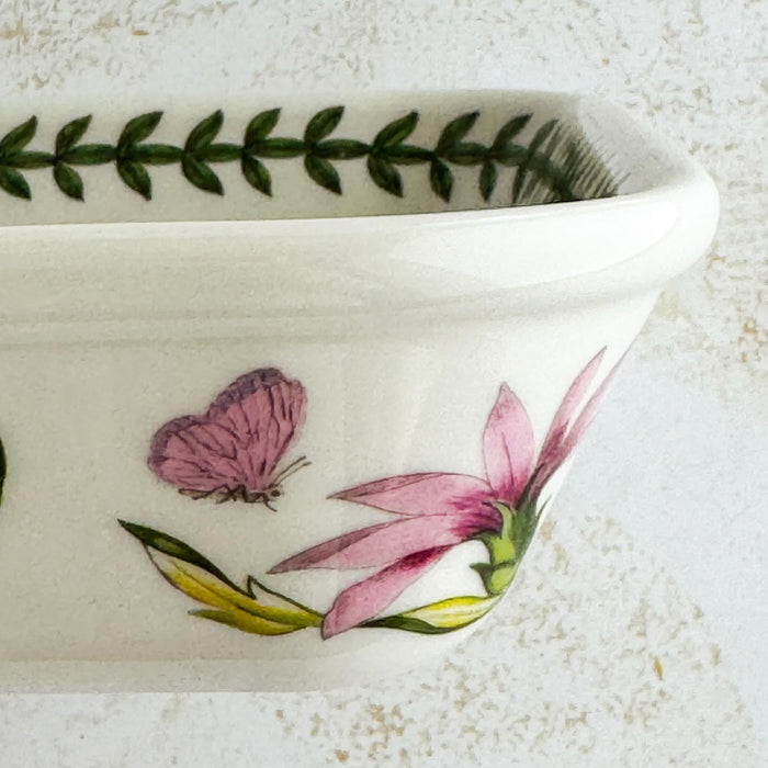 Right side profile of baking dish with floral and butterfly design