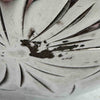 Close-up of silver loss on back side of silver shaker