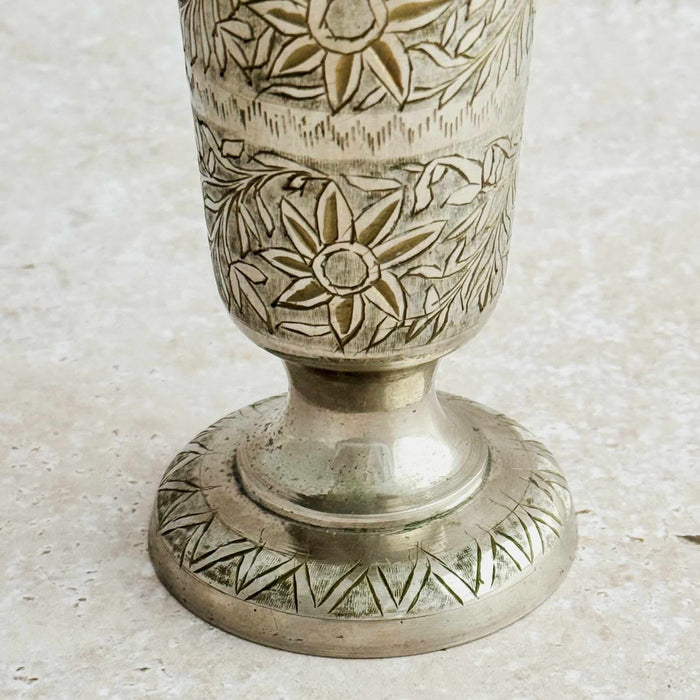 Close-up of footed base of engraved bud vase