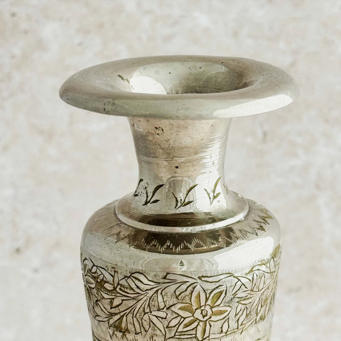 Close-up of top of engraved bud vase