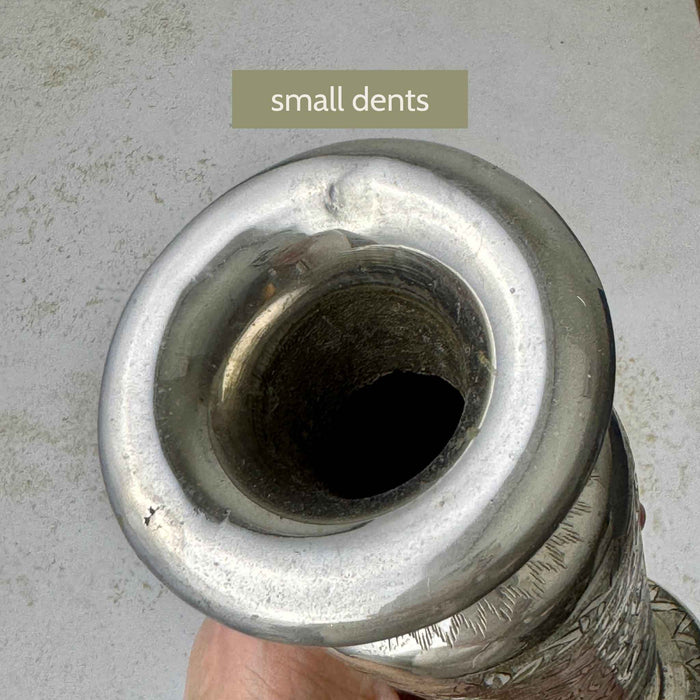 Top view of the vase opening and flared rim showing small dents along the rim with label "small dents".