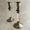 Staggered view of silver lucite candle holders