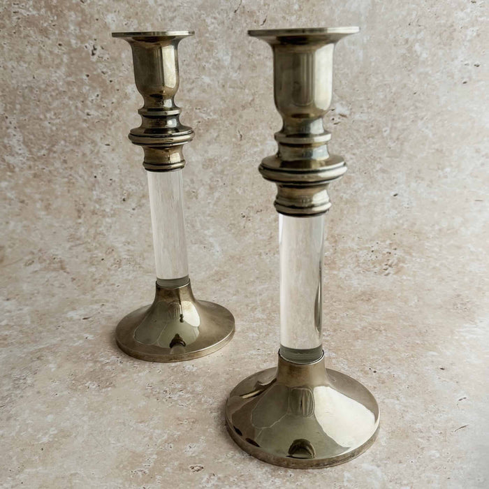 Staggered view of silver lucite candle holders