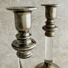 Staggered view of tops of the silver lucite candle holders