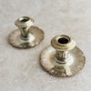 Staggered view of two Art Deco candle holders