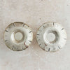 Undersides of Art Deco candle holders