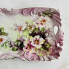 Close-up of right side of rose floral tray highlighting swired ruffled border