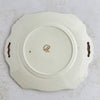Back of cake plate showing maker's mark