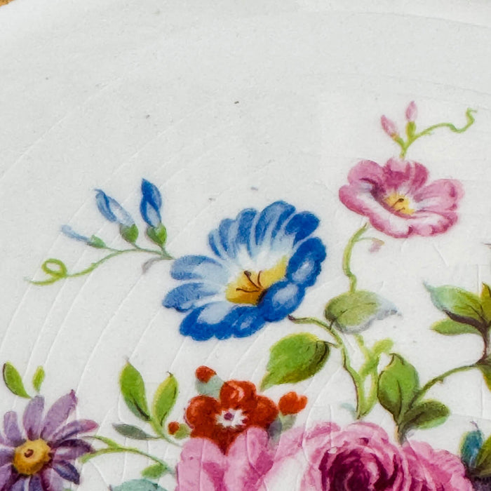 Close-up of cake plate floral decoration and crazing