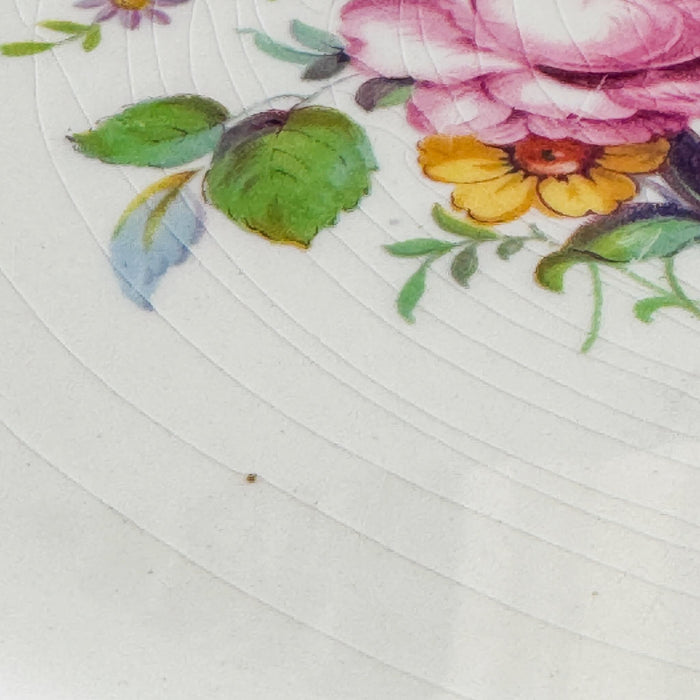 Close-up of cake plate floral decoration and crazing