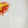 Close-up of cake plate floral decoration and crazing