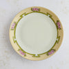 Front view of antique Bavaria plate with floral border on a light background