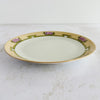 Side profile of hand-painted antique plate