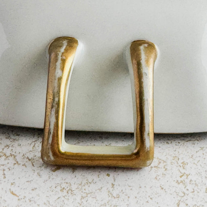 Close-up of wear to gilt on underside of handle