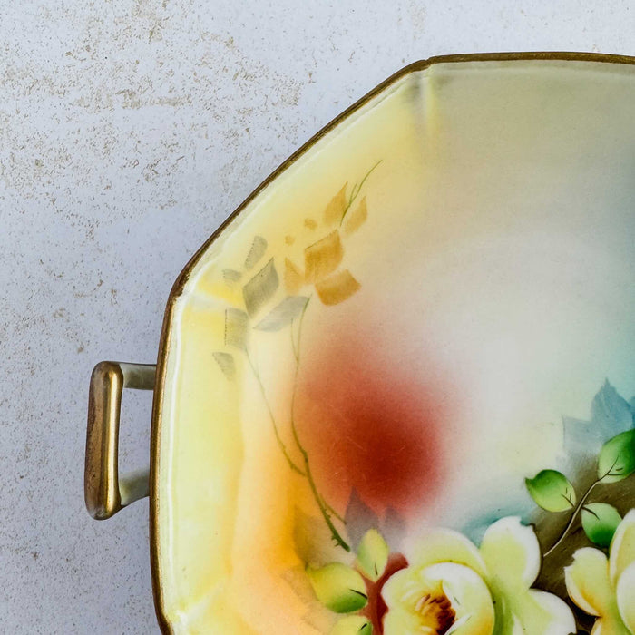 Close-up of Meito China hand-painted detail showing red area