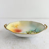 Side view of Meito China hand-painted dish