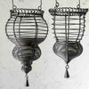 Closeup profile view of two hanging wire baskets