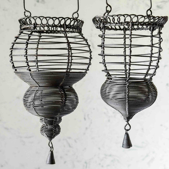 Closeup profile view of two hanging wire baskets
