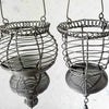Closeup angled profile view of hanging wire baskets