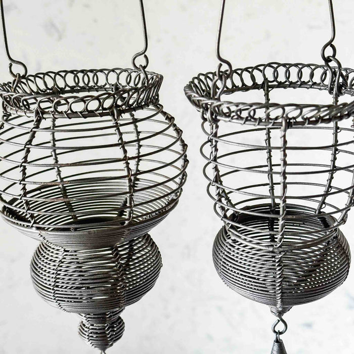 Closeup angled profile view of hanging wire baskets