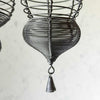 Closeup of drop finial and wire tassel on smaller hanging basket