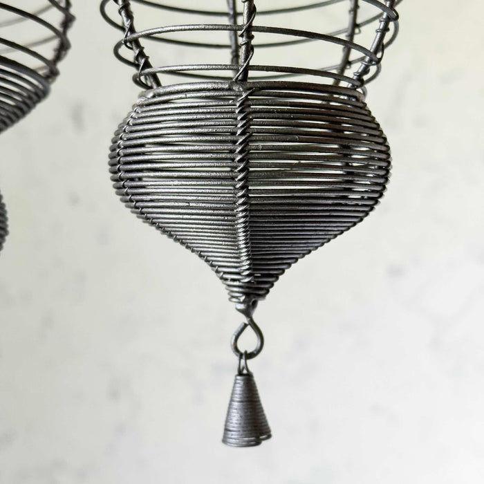 Closeup of drop finial and wire tassel on smaller hanging basket
