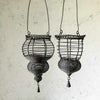 Profile view of two hanging wire baskets