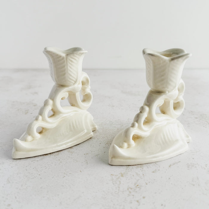 Three-quarter view of Art Deco candle holders facing away