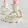 Close-up profile view of Art Deco candle holder with mate in background