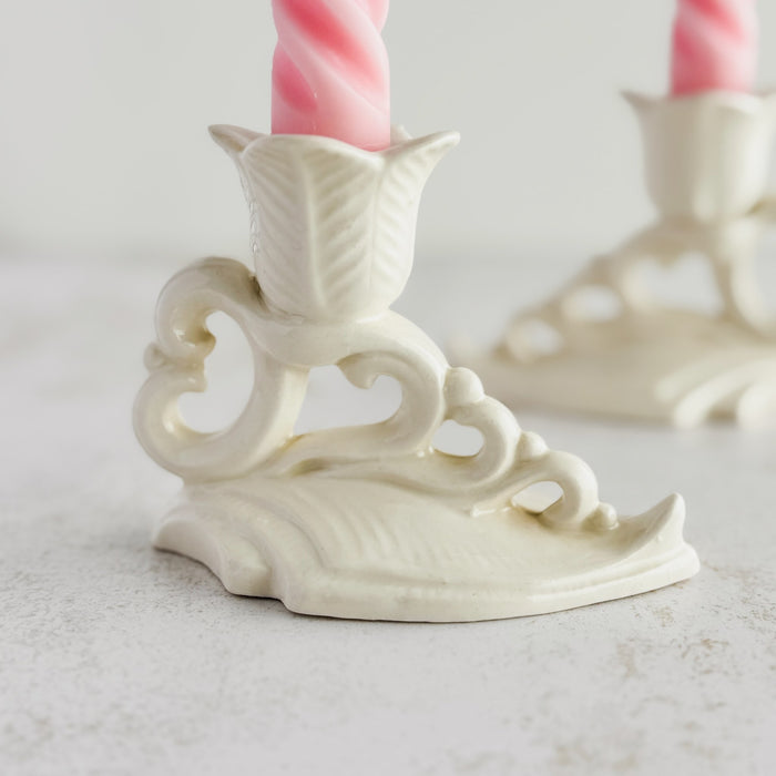 Close-up profile view of Art Deco candle holder with mate in background