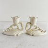 Side profile view of pair of Art Deco candle holders