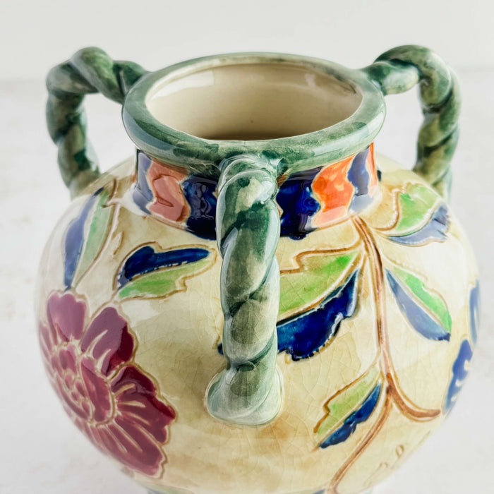 Close-up view of the triple handles on the Maruhon majolica vase