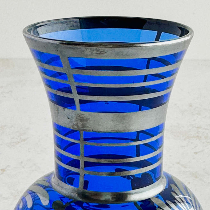 Close-up of silver overlay bands on neck of vase