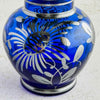 Close-up of floral silver overlay on vase