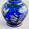 Close-up of floral silver overlay on vase