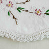 Close-up of embroidery and crochet edge on pillowcase