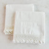 Pair of folded vintage white cotton queen size pillowcases