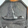 Close-up of duck in flight relief on bookend