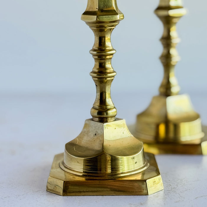 Close-up of patiina on base of candle holder stem with mate blurred in background