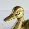 Close-up of brass duck face and bill showing hand-finished details and surface character