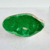 Underside of brass duck figurine showing green flocked paper covering on base