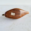 Bottom of wood and brass duck showing label