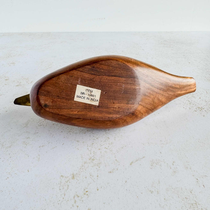Bottom of wood and brass duck showing label