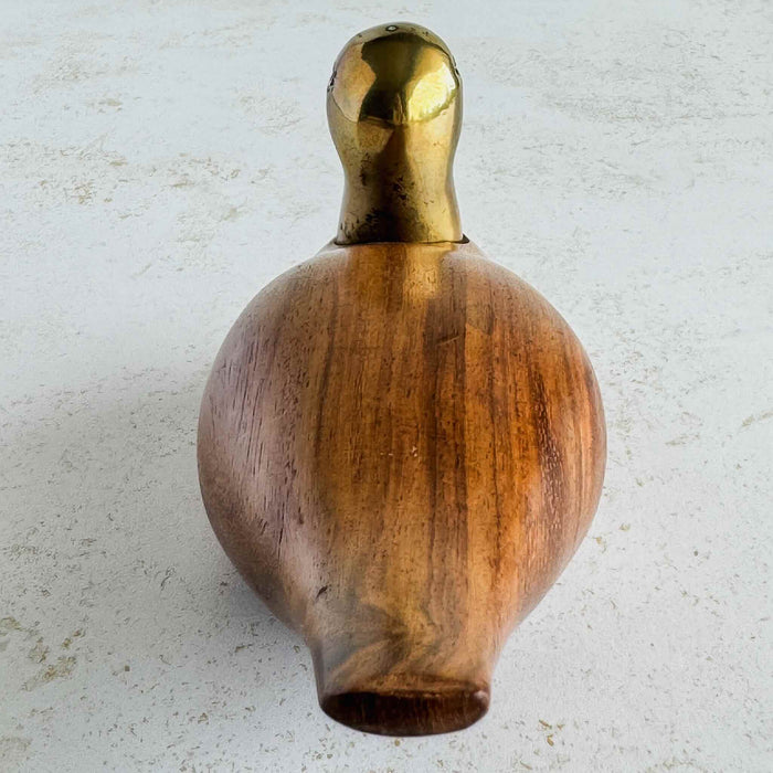Wood and brass duck facing away